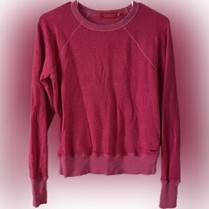 Philanthropy sweatshirt distressed in pink.